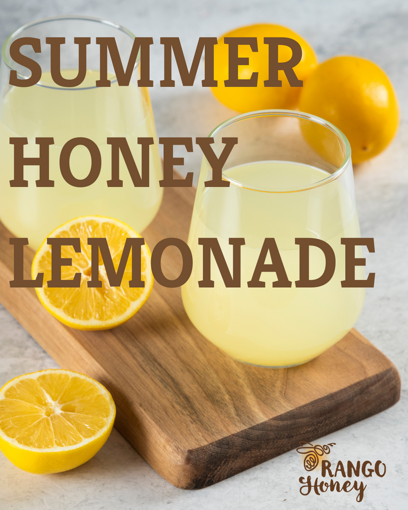lemonade in a glass jar with lemons on a cutting board